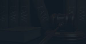 Dark view of a book and a gavel