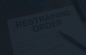 Dark view of a restraining order document