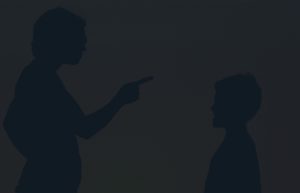 Dark view of the shadow of a woman and her child arguing